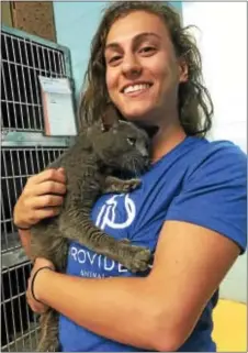  ??  ?? AJ with Providence Animal Center Intake Associate Tal Dorfman.