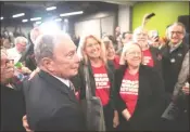  ?? aP-david Goldman ?? Democratic presidenti­al candidate and former New York City Mayor Michael Bloomberg, left, has a photo taken with members of Moms Demand Action for Gun Sense in America at a campaign event Wednesday, Feb. 5, in Providence, R.I.