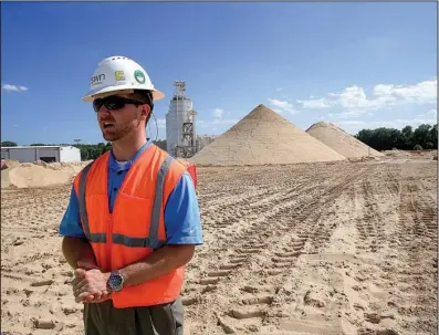  ?? Arkansas Democrat-Gazette/STATON BREIDENTHA­L ?? Britt Mitchell, a manager at Southweste­rn Energy’s sand facility in North Little Rock, explains the mining process during a tour last
month.