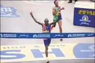  ?? Ryan McBride / Getty Images ?? Kenyan Lawrence Cherono edges Ethopian Lelisa Desisa for first place at the Boston Marathon last year.