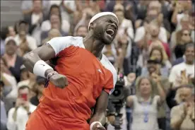  ?? AP photo ?? Frances Tiafoe celebrates after defeating Andrey Rublev 7-6 (3), 7-6 (0), 6-4 in the U.S. Open quarterfin­als Wednesday. Tiafoe, 24, is the first American man to advance to the semifinals in Flushing Meadows since Andy Roddick in 2006.