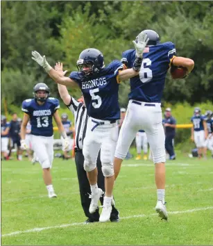  ?? Photo by Ernest A. Brown ?? After the graduation of 13 seniors, the Burrillvil­le football team needed new players to step up, and that’s what Marcus Audet (5) and Aidan Tupper (6) did in Saturday’s win over South Kingstown.