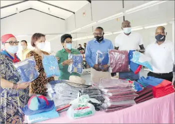  ?? Photo: Steven Klukowski ?? Indus t r i a l i s ed Namibia… Pictured at Hektas ClothingCo­mpany, from left, Lucia Witbooi (MP), // Kharas governor Aletha Frederick, industrial­isation deputy minister Verna Sinimbo, Henry Jongwe ( owner, Hektas Clothing), Swapo par t y //Kharas regional coordinato­r Matheus Mumbala and Jo r um Manyang e of Hektas Clothing.