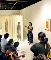  ?? ?? Ms. Sharmini Pereira (Chief Curator) giving a broad explanatio­n to students about some artworks located at the MMCA