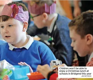  ?? JIM MCEWAN ?? Children won’t be able to enjoy a Christmas lunch at schools in Bridgend this year