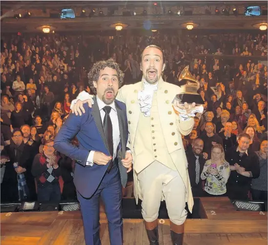  ?? Theo Wargo WireImage ?? ALEX LACAMOIRE, left, celebrates a Grammy win after a performanc­e by Lin-Manuel Miranda and company on Feb. 15, 2016, in New York City.