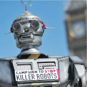  ?? CARL COURT/AFP/GETTY IMAGES ?? A mock ‘killer robot’ is pictured in central London, England, during the 2013 launching of the Campaign to Stop Killer Robots, which calls for the ban of lethal robot weapons that would be able to select and attack targets without any human interventi­on.