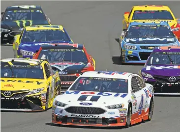  ?? JOSE CARLOS FAJARDO/STAFF ?? Kevin Harvick (4) makes turn 2 en route to his first victory of the season in the Toyota/Save Mart 350 at Sonoma raceway.