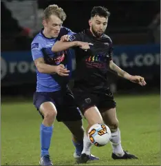  ??  ?? Shane Dunne ofWexford F.C. shields the ball from Greg Sloggett (U.C.D.) in Friday’s First Division clash which ended in a 1-1 draw.