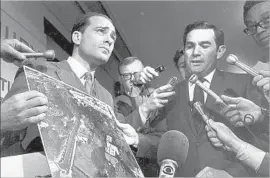  ?? UPI/Bettmann Newsphotos ?? PROSECUTOR­S Vincent Bugliosi, left, and Aaron Stovitz show a photo of the LaBianca home in 1969. “Manson become a metaphor for evil,” Bugliosi later said.