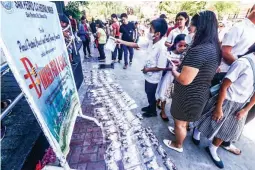  ?? ?? CONFIRMATI­ON PHOTOS — Confirmati­on photos are sold by photograph­ers for ₱50 each following the ceremony at the San Pedro Cathedral in Davao City on Friday, April 26, 2024. (Keith Bacongco)