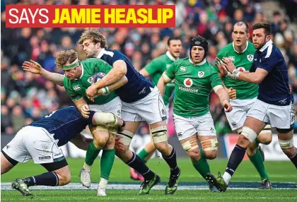  ??  ?? Hard Knocks: Jamie Heaslip is tackled by Zander Fagerson, left, and Richie Gray of Scotland during the defeat in 2017 at Murrayfiel­d