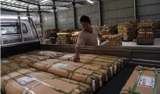  ?? AFP ?? A Taobao Village furniture factory in Xuzhou prepares a shipment for November 11 deliveries