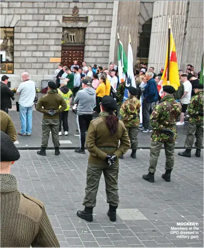  ??  ?? Mockery: Marchers at the GPO dressed in military garb