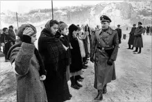  ?? THE ASSOCIATED PRESS FILE PHOTO ?? Ralph Fiennes, right, as an SS commandant, with Embeth Davidtz, second from right in “Schindler’s List,” a film that demonstrat­es the horrors of genocide and the evils that spreading hate can inspire.