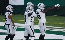  ?? BILL KOSTROUN — THE ASSOCIATED PRESS ?? The Raiders’ Clelin Ferrell, right, who had two strip sacks against the Jets, celebrates a turnover with teammates during the first half Sunday.