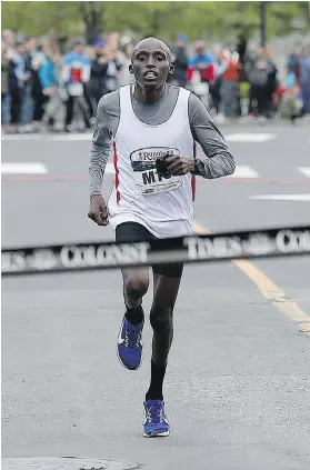  ?? ADRIAN LAM, TIMES COLONIST ?? Haron Kiptoo Sirma of Kenya was first across the finish line on Sunday, while Dayna Pidhoresky of Ontario was the first woman to finish.