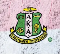  ??  ?? Christina Kirk's sweater features the Alpha Kappa Alpha (AKA) Black Greek sorority crest.