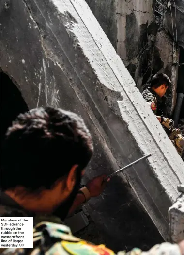  ?? AFP ?? Members of the SDF advance through the rubble on the western front line of Raqqa yesterday