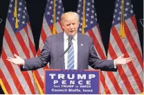  ?? JOHN LOCHER/ASSOCIATED PRESS ?? Republican presidenti­al candidate Donald Trump speaks at a rally in Council Bluffs, Iowa, on Wednesday. He said if Clinton is elected, she “would put the Oval Office up for sale.”