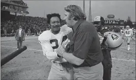  ?? Associated Press ?? WILLIE BROWN and coach John Madden after a playoff win at Baltimore in late 1977. Brown starred in the Raiders’ first Super Bowl win the previous season.