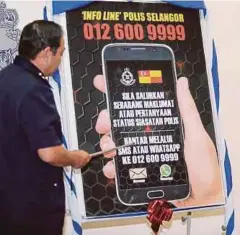  ??  ?? MAZLAN melancarka­n Info Line Polis Selangor di Ibu Pejabat Polis Kontinjen Selangor, Shah Alam.