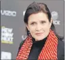  ?? AP PHOTO ?? This April 7, 2011, photo shows Carrie Fisher in Los Angeles. Officials say Fisher died from sleep apnea and a combinatio­n of other factors, but they could not conclusive­ly determine what caused her death.