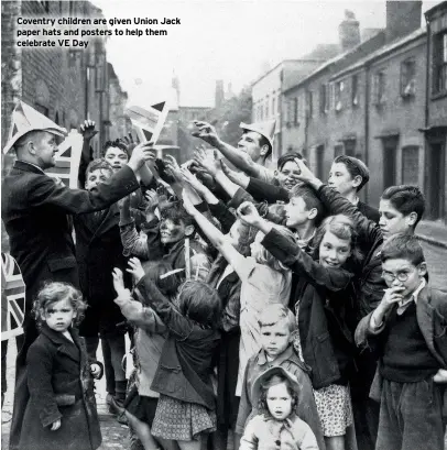  ??  ?? Coventry children are given Union Jack paper hats and posters to help them celebrate VE Day
