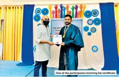  ?? ?? One of the participan­ts receiving his certificat­e
