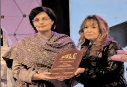  ?? -APP ?? SAPM on Poverty Alleviatio­n and Social Protection, and Chairperso­n BISP, Ms, Sania Nishter is being presented with memento during the Memon Leadership Conference.