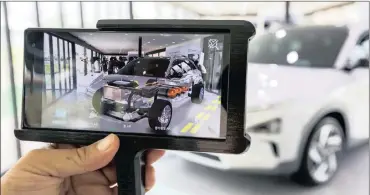  ?? PHOTO: BLOOMBERG ?? Hyundai’s next-generation fuel-cell electric sport utility vehicle powertrain system is seen on an augmented reality monitor during an unveiling event in Seoul, South Korea yesterday.