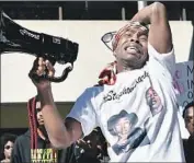  ?? Josh Edelson AFP/Getty Images ?? STEVANTE CLARK addresses protesters in March 2018 after police killed his brother in Sacramento.