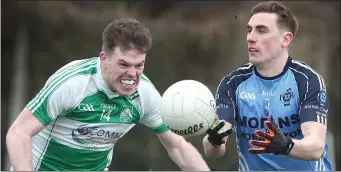  ??  ?? Bective’s Marty Mulhall looks determined to get to St Colmcille’s man Carl Mullen before he can pass the ball during Sunday’s Division 2 game at Piltown.