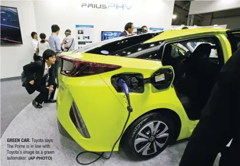  ?? (AP PHOTO) ?? GREEN CAR. Toyota says The Prime is in line with Toyota’s image as a green automaker.