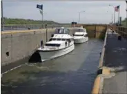  ?? MIKE GROLL, FILE — ASSOCIATED PRESS ?? In this May 8, 2008file photo, boats wait for Lock 7to fill as they travel along the Erie Canal in Niskayuna, N.Y. It was an engineerin­g marvel that brought tremendous wealth to New York and opened up the North American interior, helping turn the...