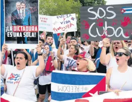  ?? AP ?? Demonstrat­ors shout their solidarity with the Cuban people against the government during a rally outside the White House in Washington on Saturday, July 17.