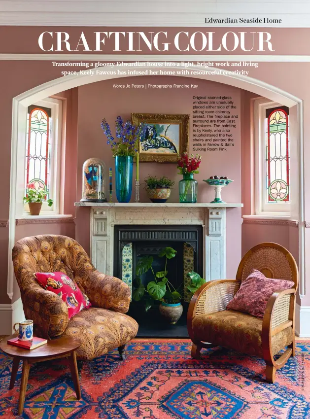  ??  ?? Original stained-glass windows are unusually placed either side of the sitting room chimney breast. The fireplace and surround are from Cast Fireplaces. The painting is by Keely, who also reupholste­red the two chairs and painted the walls in Farrow & Ball’s Sulking Room Pink