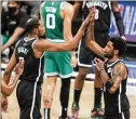  ?? COREY SIPKIN/ AP 2021 ?? In better days, Nets forward Kevin Durant (left) and guard Kyrie Irving celebrate a playoff victory over the Celtics in 2021.