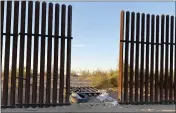  ?? US CUSTOMS AND BORDER PROTECTION VIA AP ?? This photo provided by the US Customs and Border Protection shows a hole cut into Southern California’s border fence with Mexico on Wednesday, March 3, 2021. Thirteen people killed in one of the deadliest border crashes on record were among more than 40 migrants who entered the U.S. through the hole cut into Southern California’s border fence with Mexico, the Border Patrol said Wednesday.