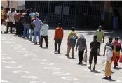  ?? — BIPLAB BANERJEE ?? People maintain social distancing during the lockdown in New Delhi on Thursday.