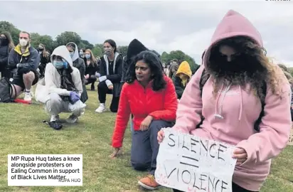  ??  ?? MP Rupa Huq takes a knee alongside protesters on Ealing Common in support of Black Lives Matter