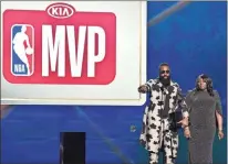  ?? / AP - Chris Pizzello ?? Rockets star James Harden joins his mother, Monja Willis, on stage to accept the most valuable player award during the NBA’s awards ceremony Monday night.