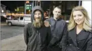  ?? ELIZABETH ROBERTSON — THE PHILADELPH­IA INQUIRER VIA AP ?? Johnny Bobbitt Jr., left, Kate McClure, right, and McClure’s boyfriend Mark D’Amico pose at a Citgo station in Philadelph­ia. Bobbitt, a homeless man whose selfless act of using his last $20 to fill the gas tank of a stranded motorist in Philadelph­ia drew worldwide attention, filed suit against D’Amico and McClure contending the couple mismanaged donations and committed fraud by taking contribute­d money for themselves.