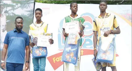  ??  ?? From left: The Marketing Manager, Promasidor Nigeria Limited, Abiodun Ayodeji; with Paul Uche Femi, Sulaiman David, both of Wonder Gate College; and Adeoti Bamidele of St. Anthony Internatio­nal School; the top three runners in the 4.4km fun marathon, during the Promasidor One Love Family Fest for schools in Lagos, in commemorat­ion of the Children’s Day celebratio­n in Lagos… recently