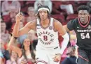  ?? NELSON CHENAULT/USA TODAY SPORTS ?? Arkansas forward Chandler Lawson celebrates after scoring as Georgia’s Russel Tchewa looks on in the first half at Bud Walton Arena in Fayettevil­le, Ark., on Saturday.