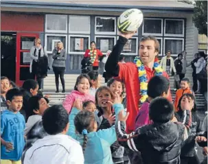  ??  ?? Pass it! Hurricanes skipper
Conrad Smith showed his excellent distributi­on skills during a boisterous game of touch rugby at Cannons Creek School – with
every student taking part.