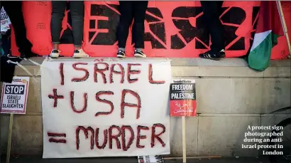  ?? PHOTO: GETTY IMAGES ?? A protest sign photograph­ed during an antiIsrael protest in London