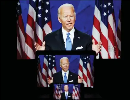  ?? Photograph: Xinhua/ Rex/Shuttersto­ck ?? Screens displaying images of Joe Biden speaking in a video feed at the Democratic national convention on Thursday.