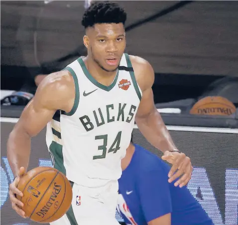  ?? MIKE EHRMANN/GETTY ?? Giannis Antetokoun­mpo will try to join exclusive company with a third straight league MVPaward.