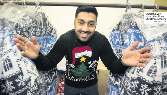  ?? VINCENT COLE ?? Saif Rafiq with some of his firm’s Christmas jumpers